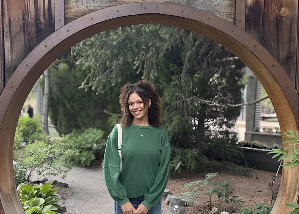 brooklynn gray standing in a hobbit hole doorway