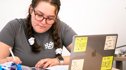 woman in a UNM shirt