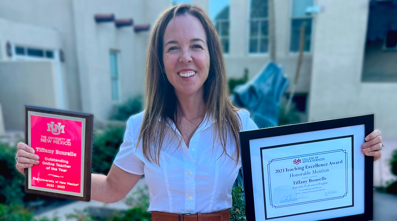 Dr. Tiffany Bourelle, Winner of the 2022-2023 Online Teacher of the Year winner proudly shows her awards